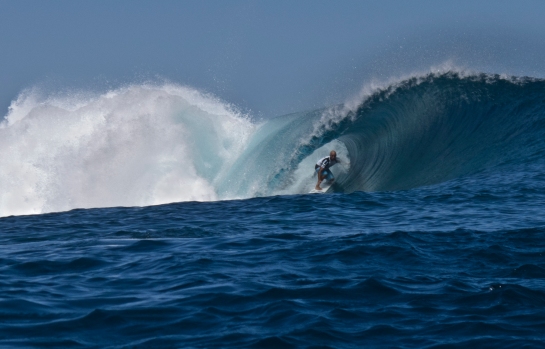 This is exactly how to ride a barrel as deep as possible at Teahupoo.
